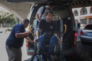 Wheelchair accessible transportation in Costa Rica. Wheelchair user shown on the lift. 